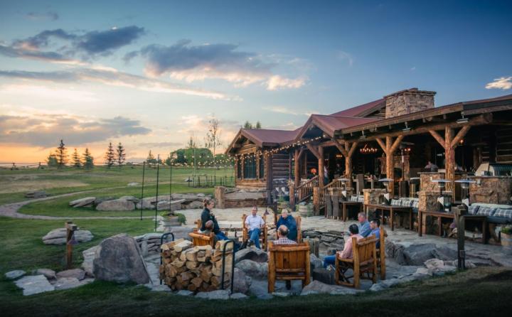 Private buyout-only ranch seats around a campfire