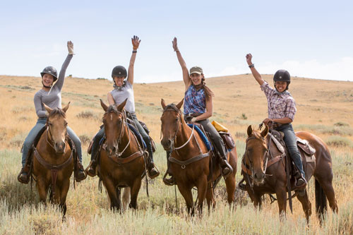 Happy family on a ranch vacation